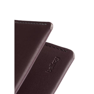 Bellroy Under Cover card sleeve in dark brown leather with embossed logo and finely stitched edges