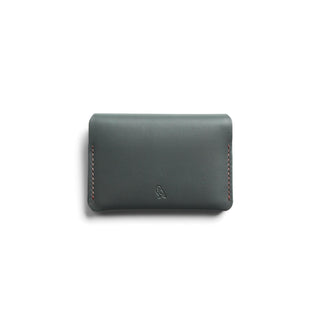 Bellroy Under Cover dark green leather card holder with minimalist design and subtle embossed logo