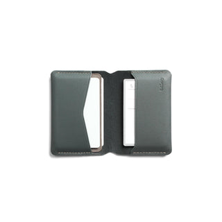 Bellroy Under Cover card holder in dark green leather with stitched edges, open to show card pockets