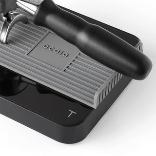 ACAIA Pearl Heat Resistant Pad in gray silicone with ridged texture under espresso portafilter handle
