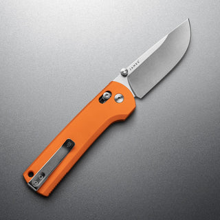 James The Kline Knife with bright orange Micarta handle and polished drop point CPM Magnacut blade open