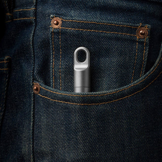 James The Randolph Capsule titanium container showing its compact design in a denim pocket by The James Brand