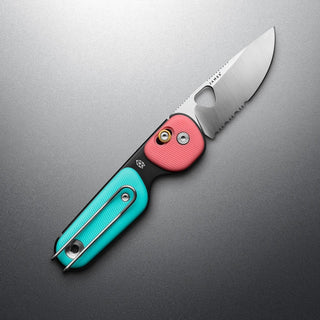 James The Redstone Knife showing two-tone polypropylene handle and stainless steel blade open on gray surface