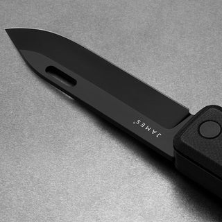 James The Ellis Scissors Knife with black Sandvik steel blade and textured handle close-up angle