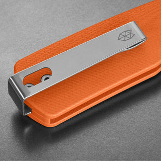 James The Carter Knife close-up on textured orange Micarta handle with stainless steel clip by The James Brand