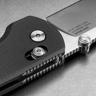 James The Kline Knife close-up showing Micarta handle texture and CPM Magnacut steel blade edge