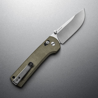 James The Kline Knife with olive Micarta handle and sleek drop point blade on gray background