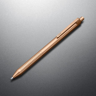 James The Burwell Ballpoint Pen in rose gold, angled on grey