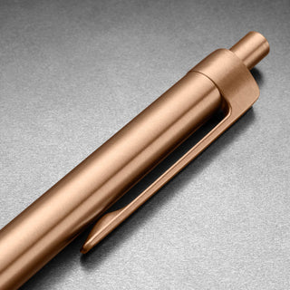 Close-up of James The Burwell Ballpoint Pen rose gold clicker and pocket clip
