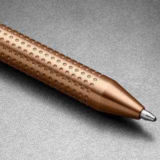Close-up of James The Burwell Ballpoint Pen rose gold textured grip and tip