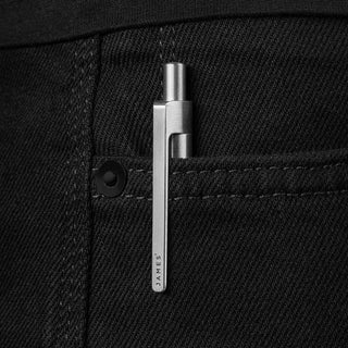James The Burwell Ballpoint Pen clipped inside a black trouser pocket
