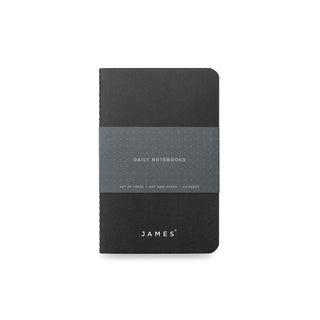 Black James The Daily Notebook - 3 Pack wrapped with a grey paper belly band