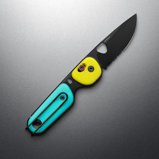 James The Redstone Knife with yellow and turquoise polypropylene handle and black blade angled on gray background