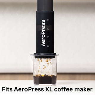 AeroPress XL Microfilters (200-Pack) with black AeroPress brewing coffee dripping into clear cup