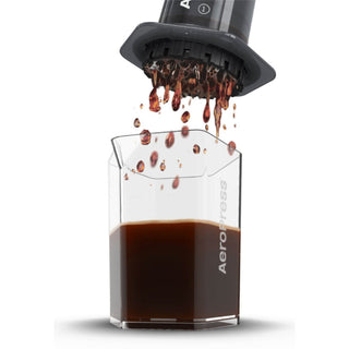 AeroPress Carafe in clear Tritan™ catching fresh brewed coffee from AeroPress brewer above