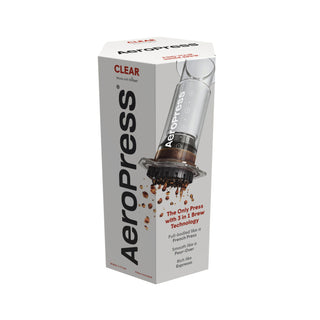 AeroPress Clear Coffee Maker packaging showing transparent brewer with coffee grounds and product features text