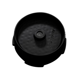 AeroPress Flow Control Filter Cap in black polypropylene with textured surface and central opening design