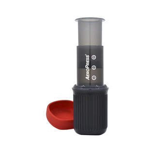 AeroPress Go Coffee Maker with black ribbed base and translucent plunger on white background