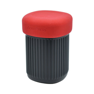 AeroPress Go Coffee Maker with compact ribbed black body and red medical-grade thermoplastic lid