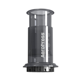 AeroPress Go Coffee Maker shown from front with clear black brewing chamber and measurement markings