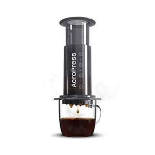 AeroPress Original Coffee Maker brewing fresh coffee with clear measurement markings on black chamber