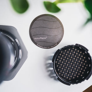 AeroPress Stainless Steel Reusable Filter showing fine mesh and sleek stainless steel surface close-up view