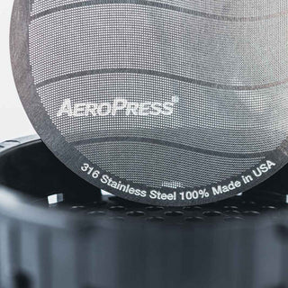 A close-up of AeroPress Stainless Steel Reusable Filter showing fine mesh and stainless steel material details