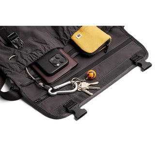 Bellroy Cinch Messenger Bag open showing organized interior pocket with keys and small pouch