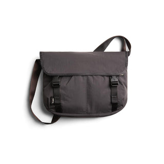 Bellroy Cinch Messenger Bag in dark recycled nylon with flap and adjustable shoulder strap