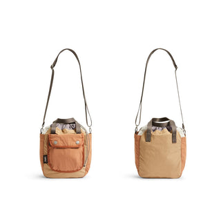 Bellroy Cinch Bucket Bag in two-tone recycled nylon with adjustable shoulder strap and front pocket closure