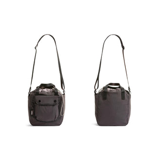 Bellroy Cinch Bucket Bag in dark recycled nylon with adjustable shoulder strap and front pocket details