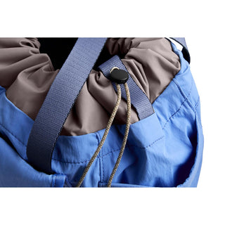 Bellroy Cinch Tote close-up showing blue recycled nylon fabric and drawstring closure details