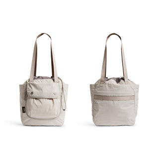 Bellroy Cinch Tote in light beige with front pocket and adjustable cinch closure straps