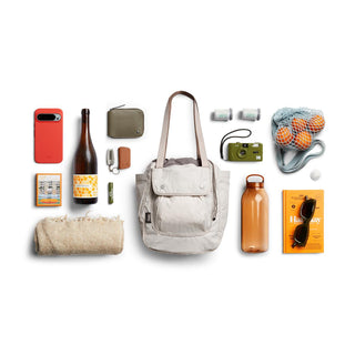 Bellroy Cinch Tote in light beige with recycled nylon material and spacious front pocket visible