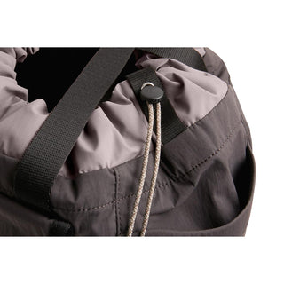 Bellroy Cinch Tote close-up of drawstring closure and textured recycled nylon fabric in muted gray tones