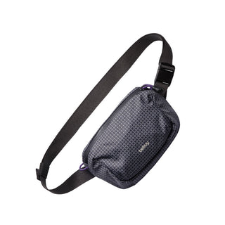 Bellroy Lite Belt Bag in dark recycled fabric with adjustable black strap and subtle logo detail
