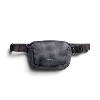 Bellroy Lite Belt Bag in textured recycled nylon with adjustable black strap laid flat on white background