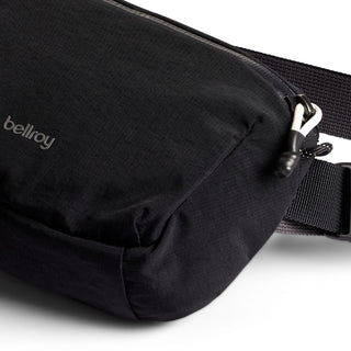 Bellroy Lite Belt Bag in black recycled nylon with textured fabric and adjustable strap detail