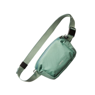 Bellroy Lite Belt Bag in muted green with adjustable strap made from recycled nylon fabric