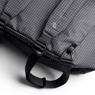 Close-up of black Bellroy Lite Totepack showing textured fabric and sturdy carry handle with hardware details