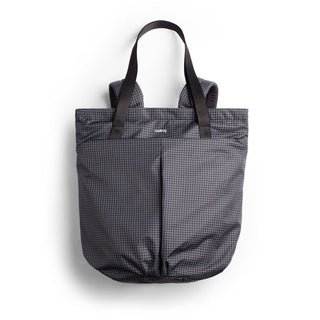 Bellroy Lite Totepack in black recycled nylon with dual straps and minimalist grid texture visible front view