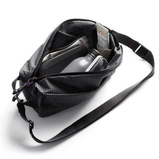 Bellroy Lite Sling crossbody bag in black with water-resistant recycled fabric and internal compartments visible