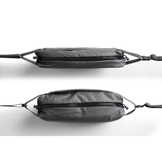 Bellroy Lite Sling crossbody bag in textured gray fabric with adjustable straps and zipped compartments