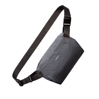 Bellroy Lite Sling Mini crossbody bag in gray with water-resistant textured fabric and adjustable strap