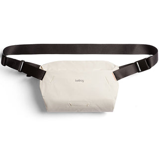 Bellroy Lite Sling Mini crossbody bag in off-white with adjustable black strap and water-resistant fabric