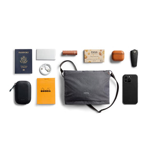 Bellroy Lite Sacoche in recycled fabric with slim crossbody design and organized everyday essentials layout