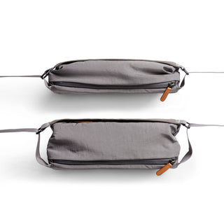 Bellroy Sling Mini Premium - 7L in grey woven fabric with leather zipper pull, shown from top and side views