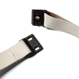 Bellroy Sling Mini Premium - 7L beige fabric strap with black plastic buckle hardware close-up