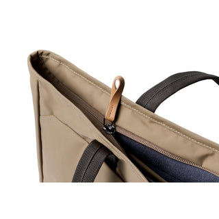 Bellroy Tokyo Tote Second Edition in beige with leather zipper pull and black fabric handles close-up