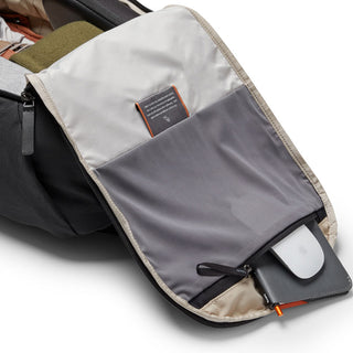 Bellroy Transit Workpack 20L interior zipper pocket holding tech accessories in light fabric lining
